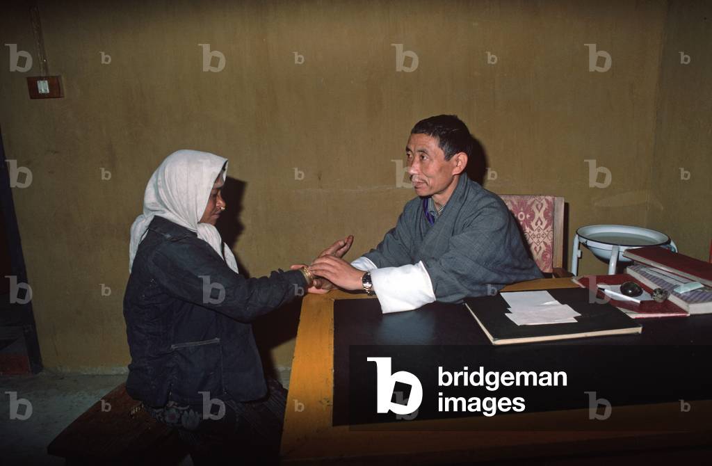 Bhutanese traditional doctor with patient , Thimphu medical centre, Thimphu, Bhutan, Himalayas (photo)