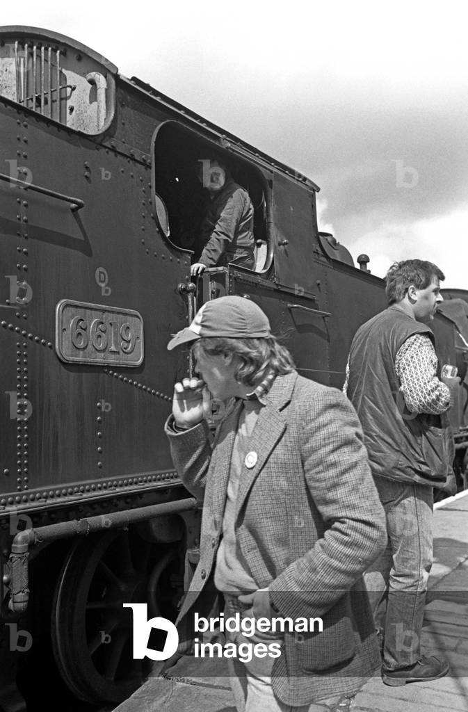 Steam train enthusiasts at Pickering station on the North Yorkshire Moors Railway, North Yorkshire, England, UK, 1992 (b/w photo)