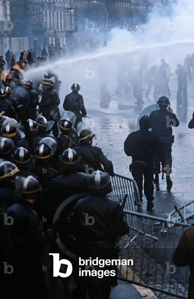 Antinuclear protesters fighting against the CRS, French National Police, in Rennes, Brittany, France, 1980 (photo)