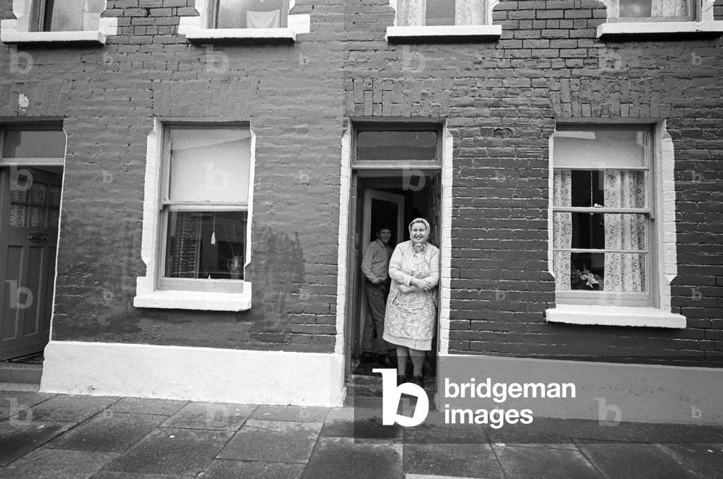 Belfast women in her terrace house, Northern Ireland early 70s during The Troubles, 1972 (b/w photo)