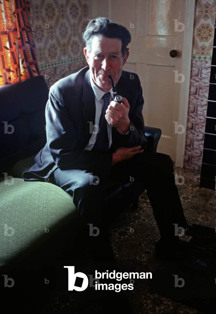 Blue Stack Mountains, farmer smoking pipe in farmhouse kitchen, Donegal, Ireland (photo)