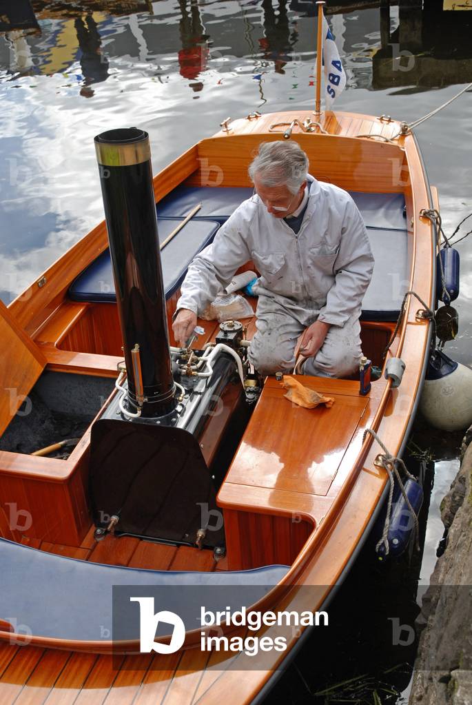 Tinkering with Steam Launch engine, Crom Estate, Upper Lough Erne, County Fermanagh, Northern Ireland, UK (photo)