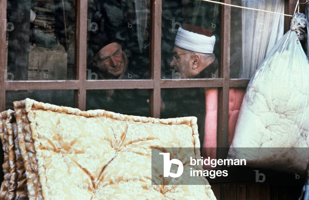 Mullah in cafe in historical market area of Sarajevo, former Yugoslavia