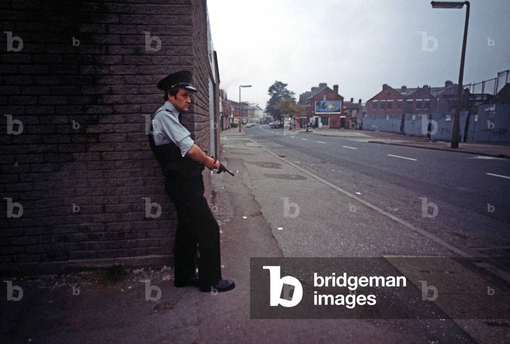 RUC, Royal Ulster Constabulary, policeman on Patrol of East Belfast Streets during The Troubles, Northern Ireland, 1978 (photo)