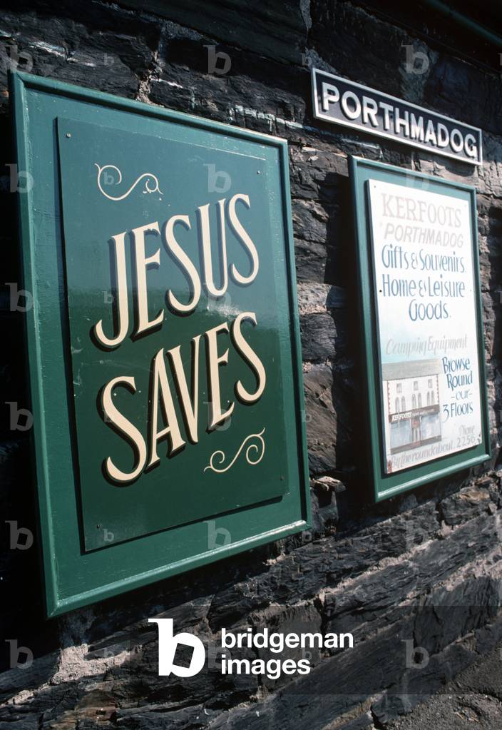 Ffestiniog Railway at Porthmadog with its religious messages on the platform, Gwynedd, North Wales, 1990 (photo)