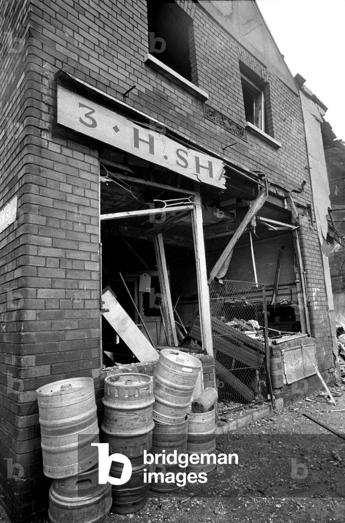 Clearing up after IRA bomb damage in the Shankill Loyalist area of Belfast in the early 70s, Northern Ireland during The Troubles, 1974 (b/w photo)