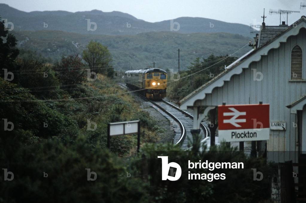 British Rail diesel train approaching Plocton railway station on the Kyle of Lochalsh line, Highlands, North West Coast of Scotland, 1982 (photograph)