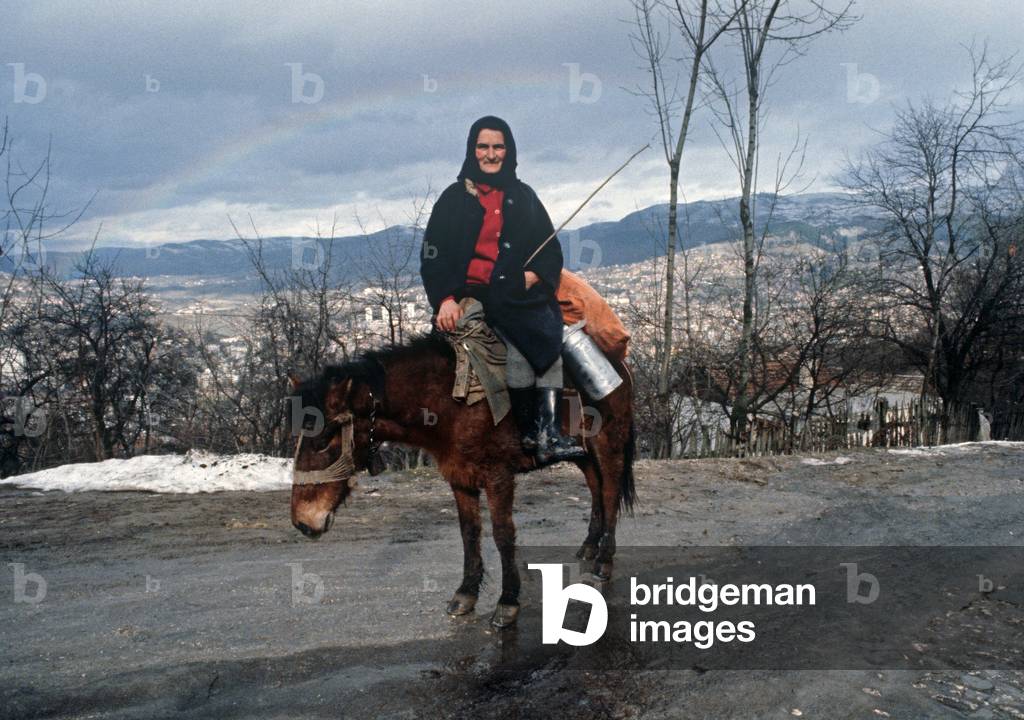 Bosnian woman on hill surrounding Sarajevo, former Yugoslavia