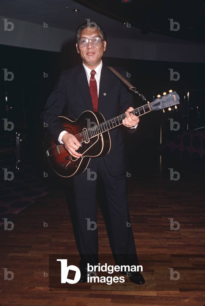 Guitar player in the Jimmy King Jazz Orchestra, Shanghai, China (photo)