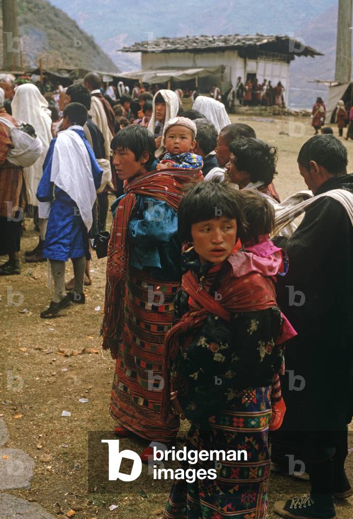 Bhutanese families at the Paro Tshechu, mask dance festival, in the Paro Dzong, Bhutan (photo)