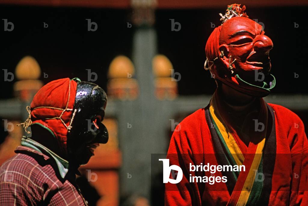 Mask actors at the Paro Tshechu, mask dance festival, in the Paro Dzong, Bhutan (photo)