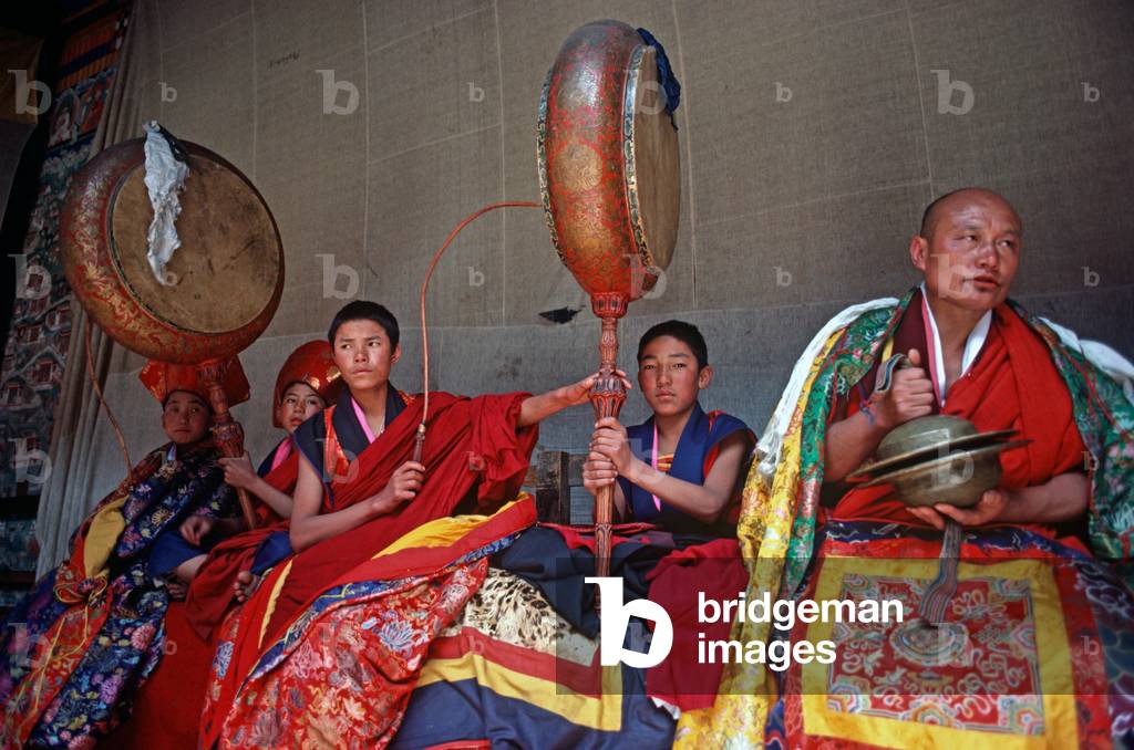 Buddhist monks at the Paro Tshechu, mask dance festival, in the Paro Dzong, Bhutan   (photo)
