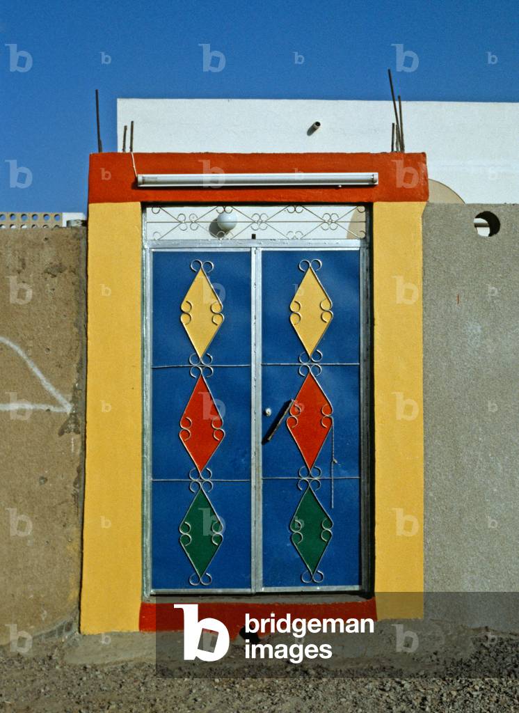 Courtyard entrance painted metal doors, Dubai, United Arab Emirates