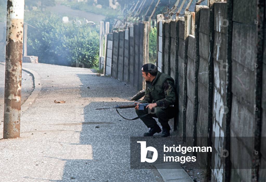 British Army Soldier taking Cover during IRA Sniper attack in West Belfast during The Troubles, Northern Ireland, 1972