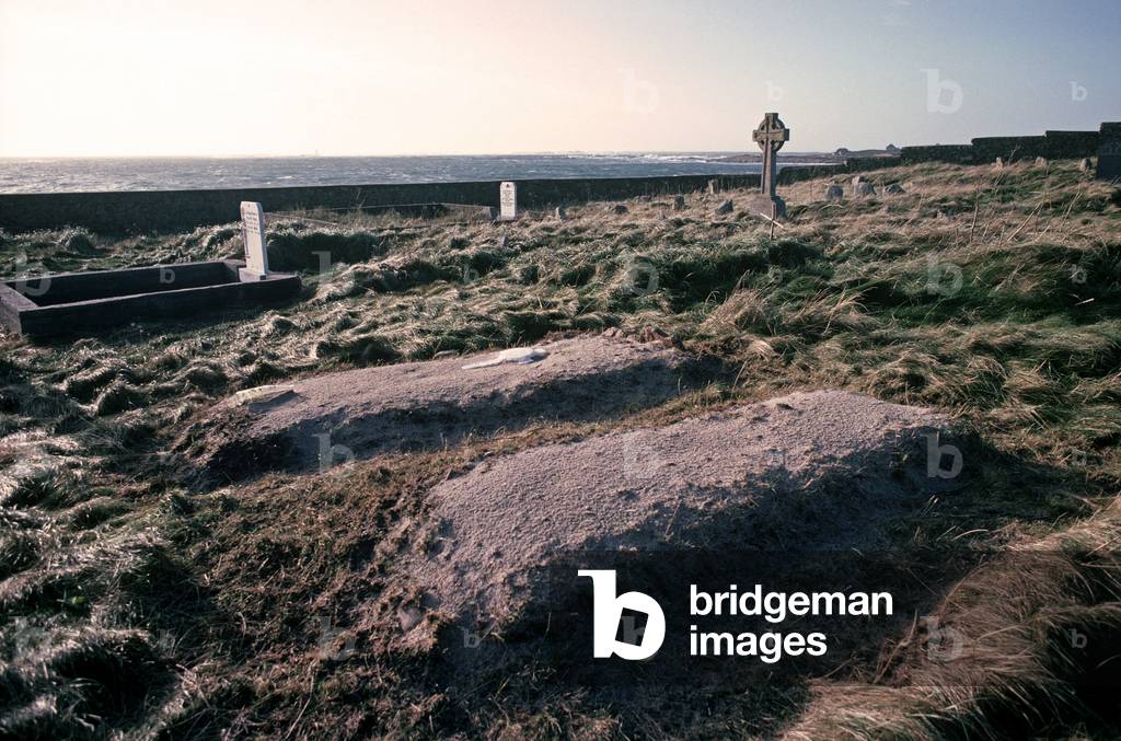 Freshly dug graves on Inishturbot island cemetery, Connemara, County Galway, Ireland (photo)