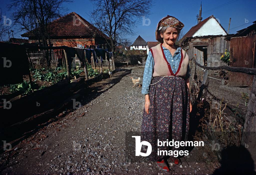 Woman in traditional dress in rural Former Yugoslavia