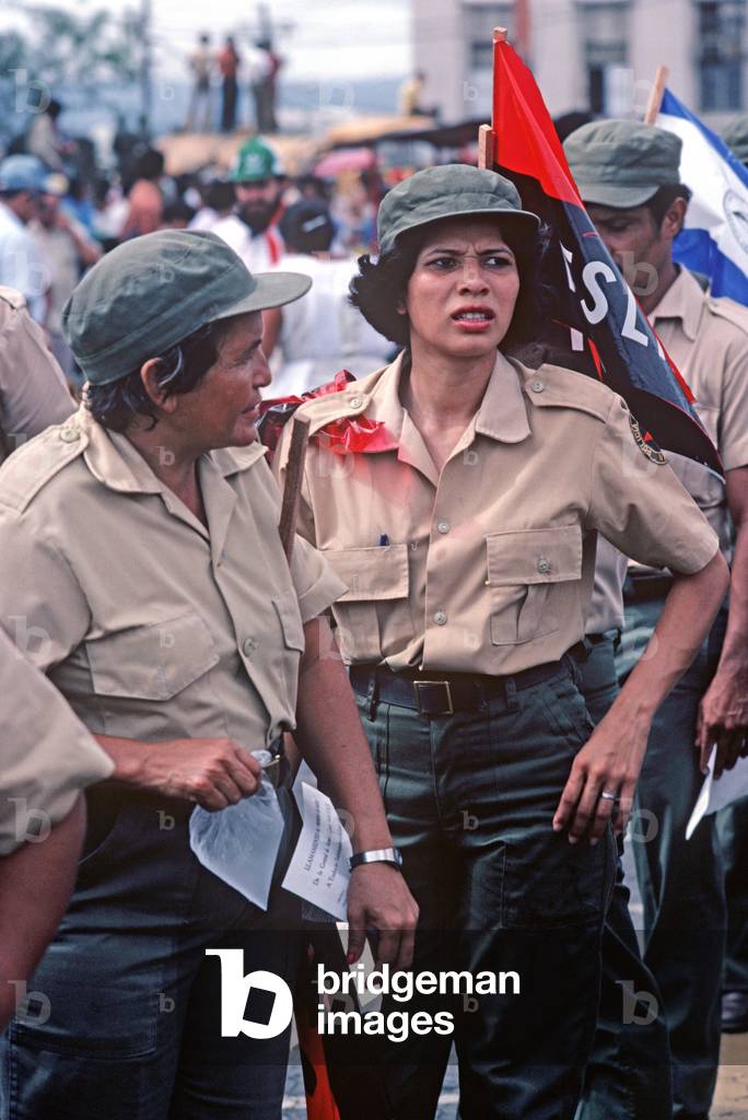 Sandinista National Front members listening to speeches at May Day rally,  Managua, Nicaragua (photo)