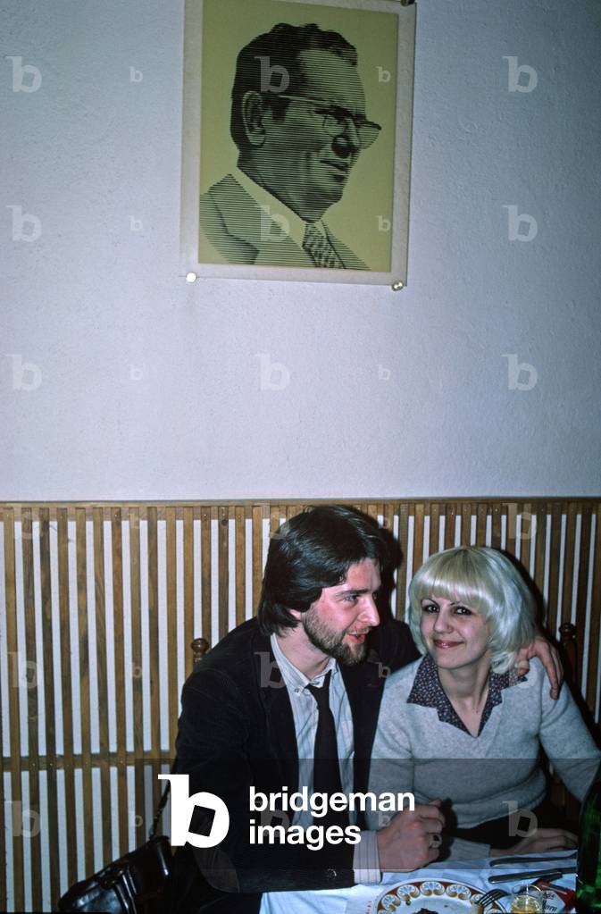 Portrait of Tito above couple in Sarajevo restaurant, former Yugoslavia