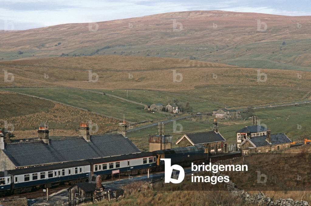 British Rail diesel train at Garsdale on the Settle to Carlisle Pennine railway line, 1981 (photograph)