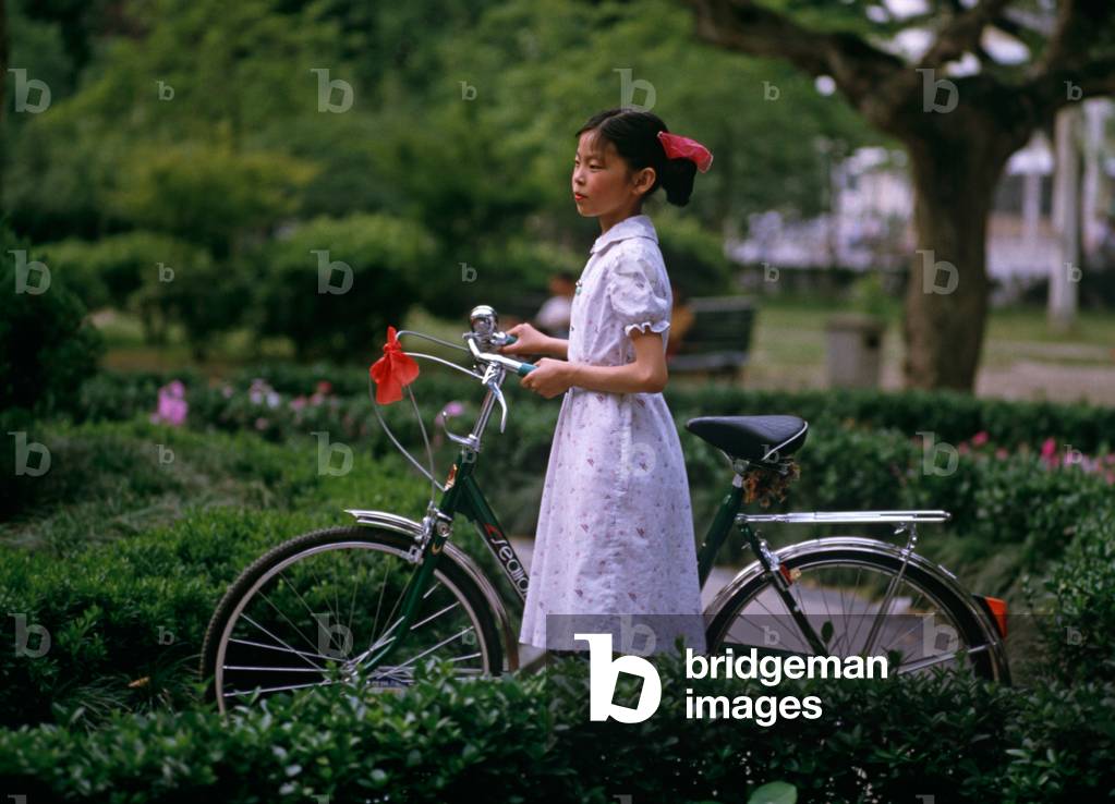 Young girl with new bicycle, Hangzhou, Zhejiang Province, China (photo)