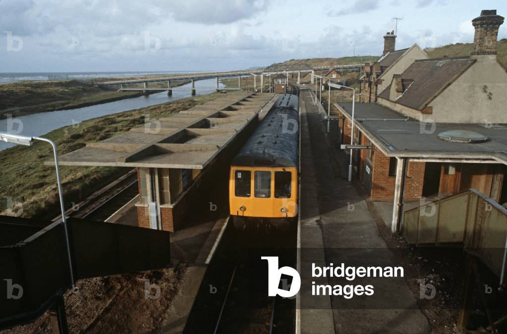 Diesel Multiple Unit train at Seascale station on the British Rail Cumbrian coast railway line, North West England, 1981 (photograph)