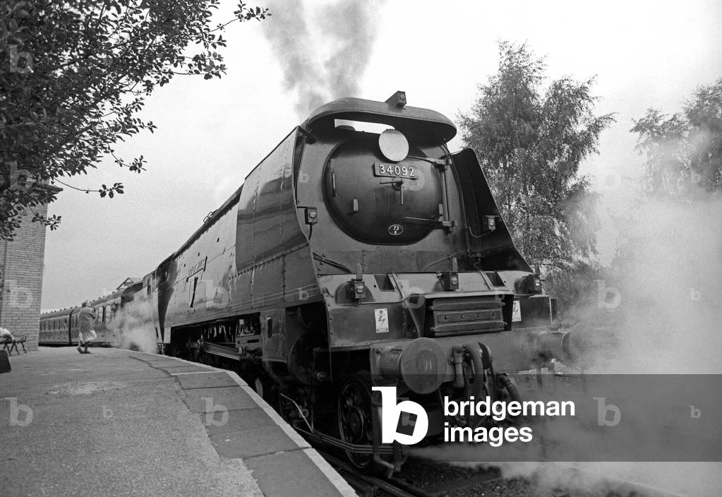 Steam locomotive ready to leave Keighley station on the heritage Keighley and Worth Railway line, West Yorkshire,  England, UK, 1989 (b/w photo)