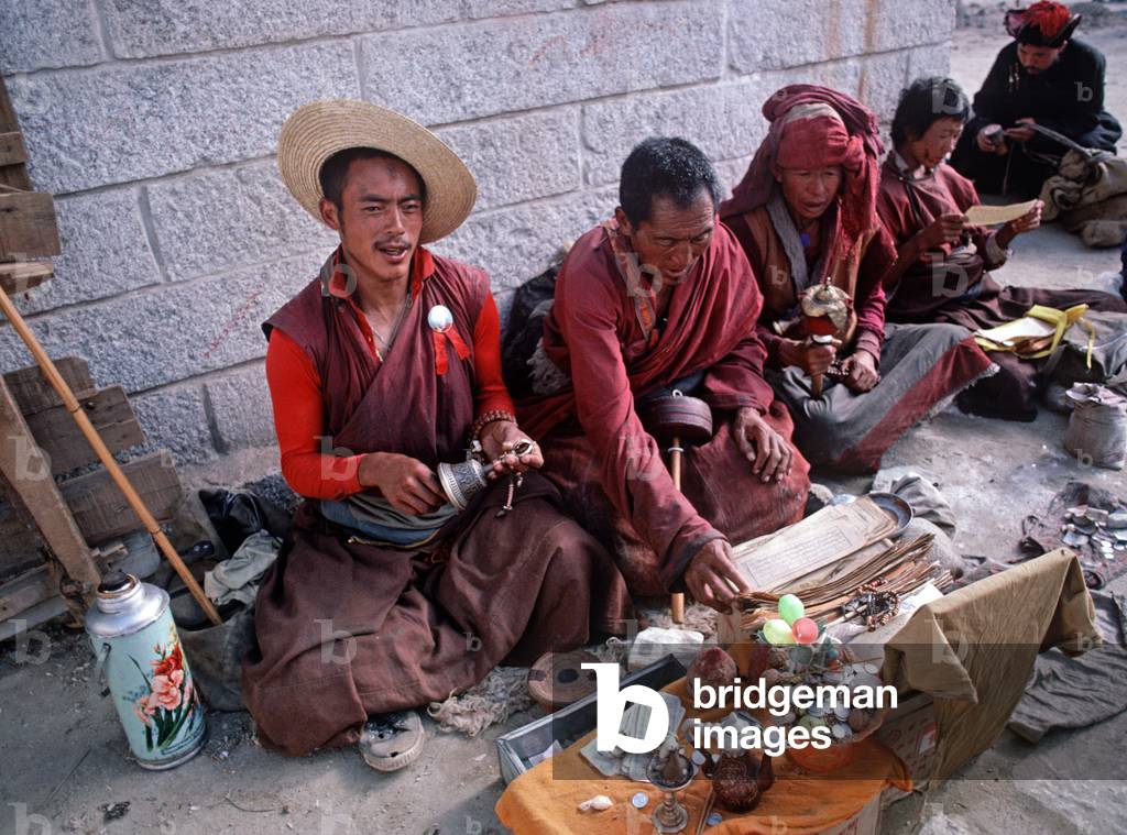 Tibetan Buddhist monks in Lhasa main square (photo)