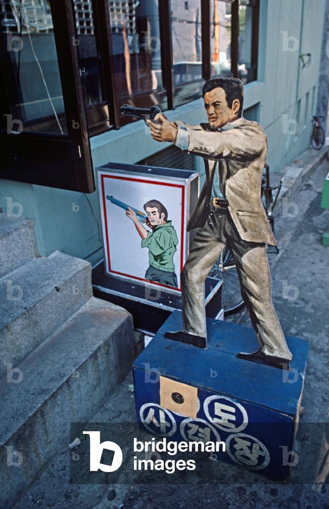 Cardboard cut out outside Seoul City cinema, advertising South Korean gangster film,  Asia, 1980s, 80s, 1980-1990 (photo)