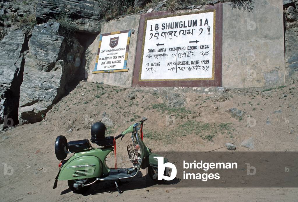 Vespa motorcycle wih crash helmut, Bhutan, Himalayas (photo)
