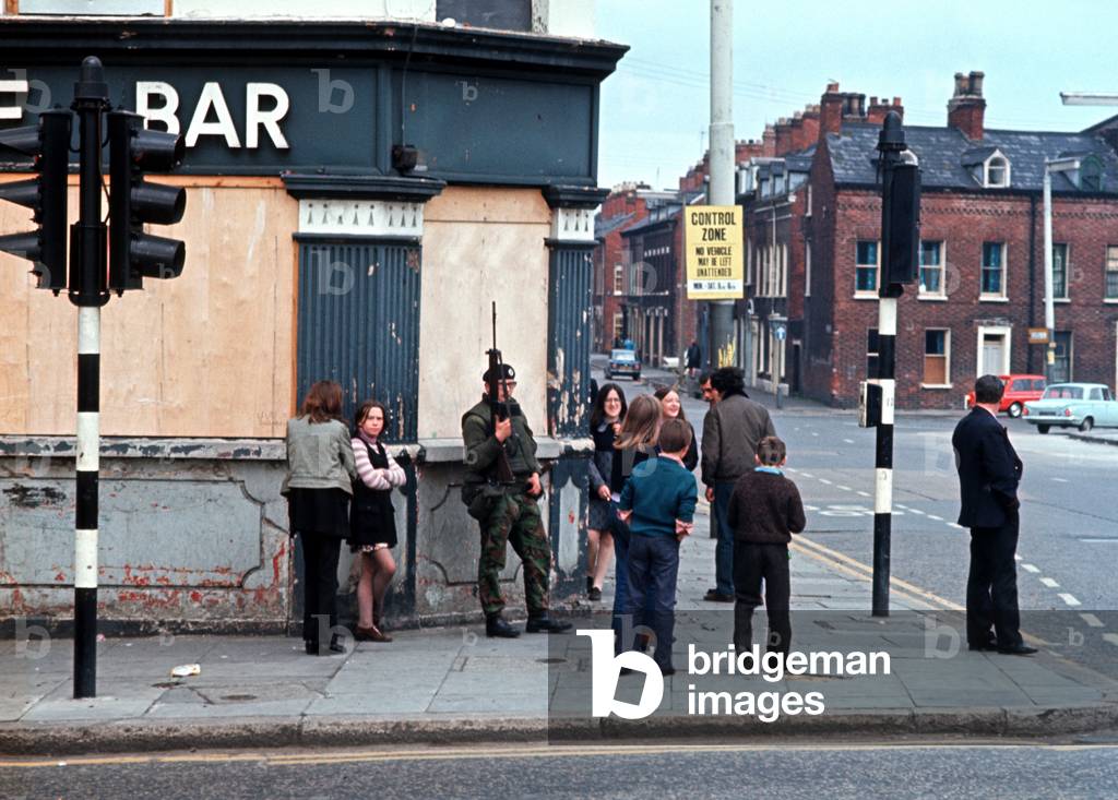 British army soldier outside Belfast City bar during The Troubles, Northern Ireland, 1972