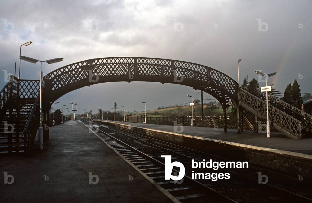 Passenger metal bridge over the British Rail Settle to Carlisle railway line at Appleby station, 1981 (photograph)