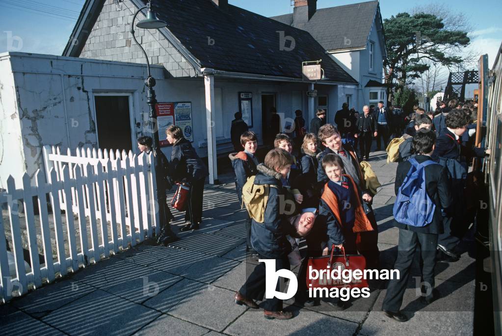 School children on the Dovey Junction to Pwllheli Cambrian Coast railway line at Harlech, Gwnedd, Wales, Great Britain, 1982 (photograph)