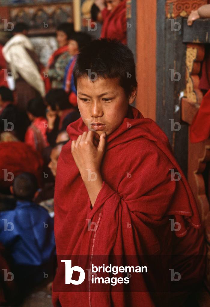 Buddhist child monks at the Paro Tshechu, mask dance festival, in the Paro Dzong, Bhutan (photo)