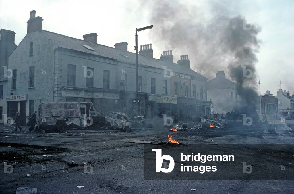 Morning after a night of riots in the Falls Road, West Belfast during The Troubles, Northern Ireland, 1976 (photo)