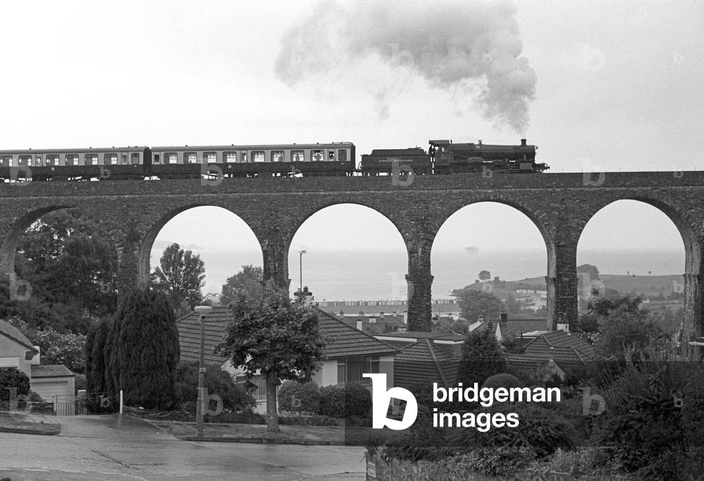 Steam train of the Heritage Dartmouth Steam Railway on the Churston Viaduct, Devon, England, UK, 1989 (b/w photo)