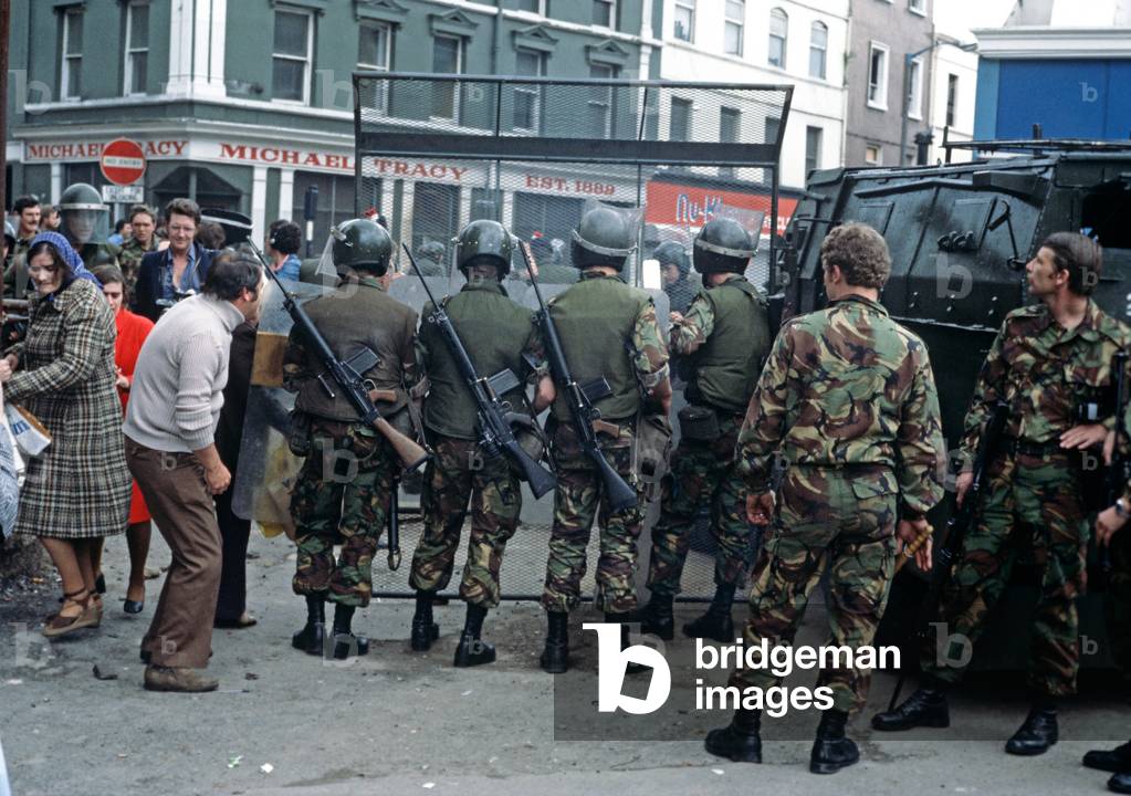 British Army controlling Rioting in the Streets of Derry after Apprentice Boys March during The Troubles, Northern Ireland, 1975