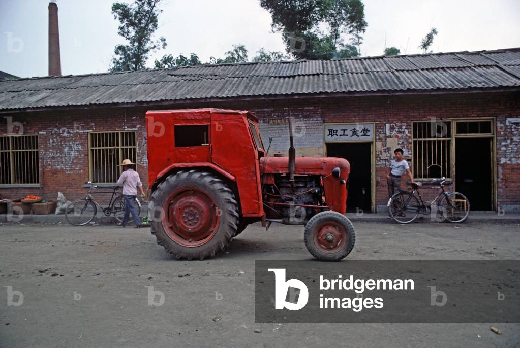 red tractor in Sichuan village, China (photo)