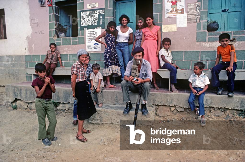 Local armed militia surrounded by Santa Maria villagers, a small village on the border with Honduras, Nicaragua, Central America (photo)