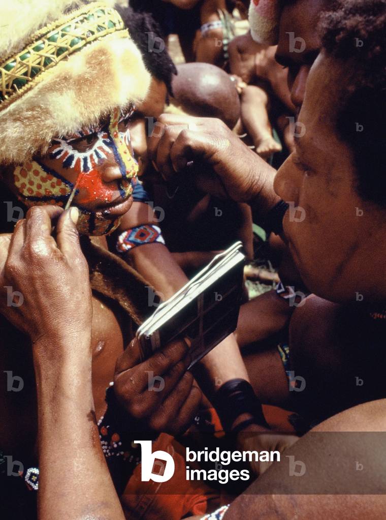 Highland mother painting her son's face, Mount Hagen, Papua New Guinea, 1974 (photo)