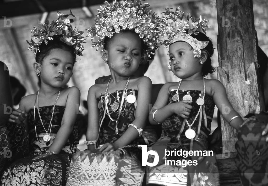 Children in traditional dresses (b/w photo)