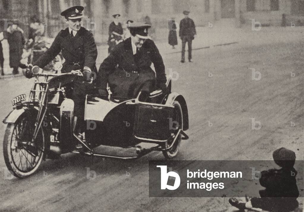 A policewoman discovering a lost child (b/w photo)