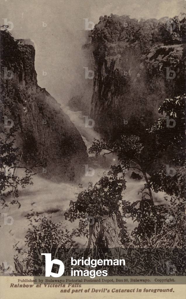 Postcard depicting a rainbow at Victoria Falls (b/w photo)