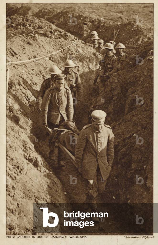 Captured Germans carrying a wounded Canadian soldier on a stretcher, World War I (b/w photo)