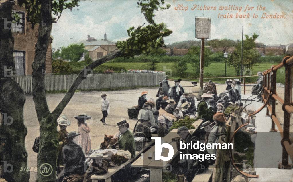 Hop pickers waiting for the train back to London (coloured photo)