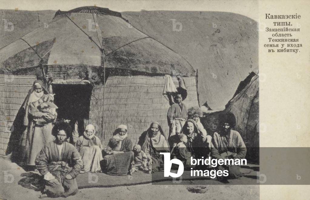 Turkmen family of the Teken tribe in front of their yurt, Transcaspian oblast, Russia, early 20th Century (b/w photo)