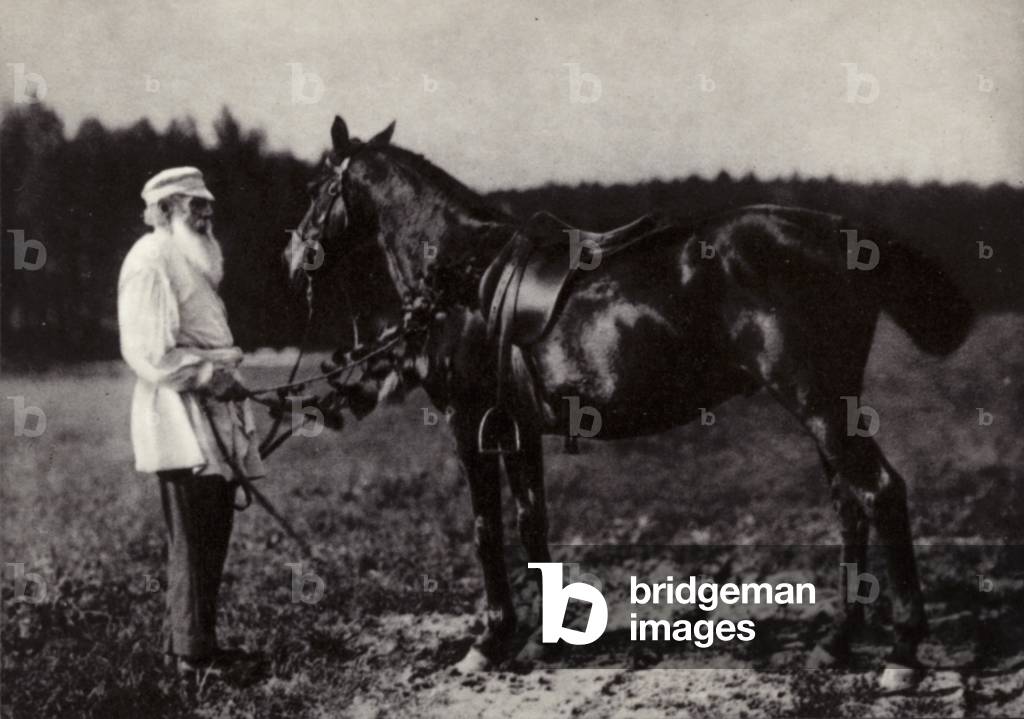 L N Tolstoi with his favourite horse Delir, Yasnaya Poliana, 1908 (b/w photo)