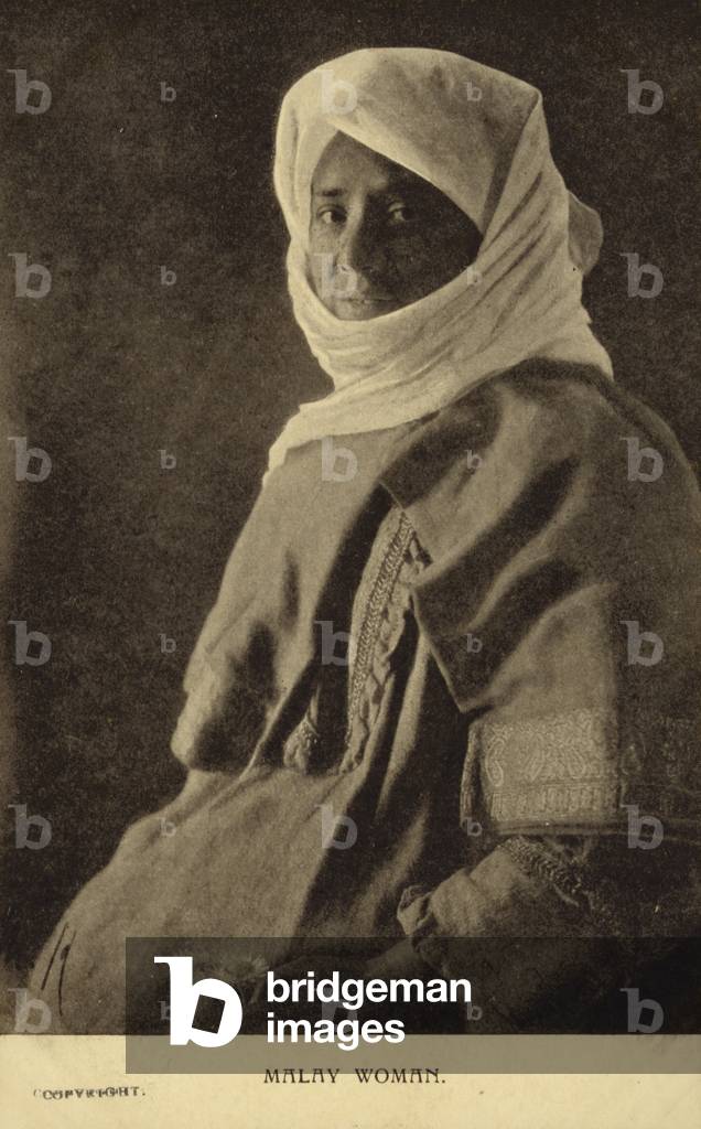 Postcard depicting a Malay woman (b/w photo)