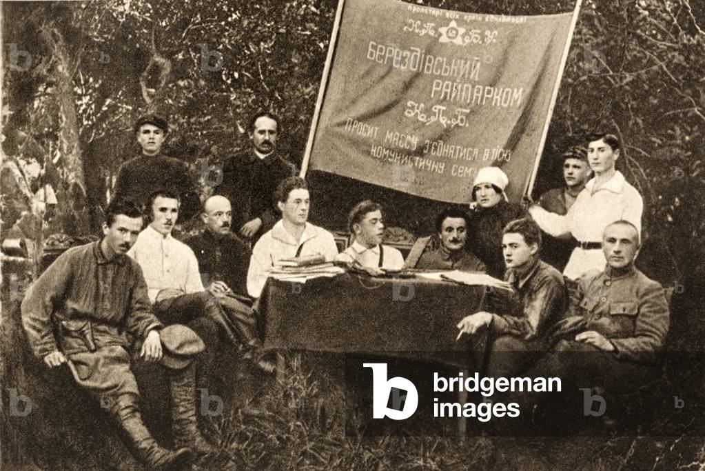 Soviet Realist author Nikolai Ostrovsky (left) with members of the Communist Party in Ukraine, USSR, 1923 (b/w photo)