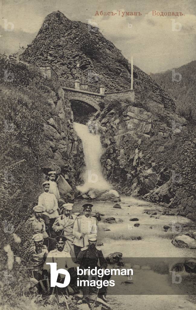 Group of Russian army officers at a waterfall near the Abastumani resort, Georgia, Russia, early 20th Century (b/w photo)
