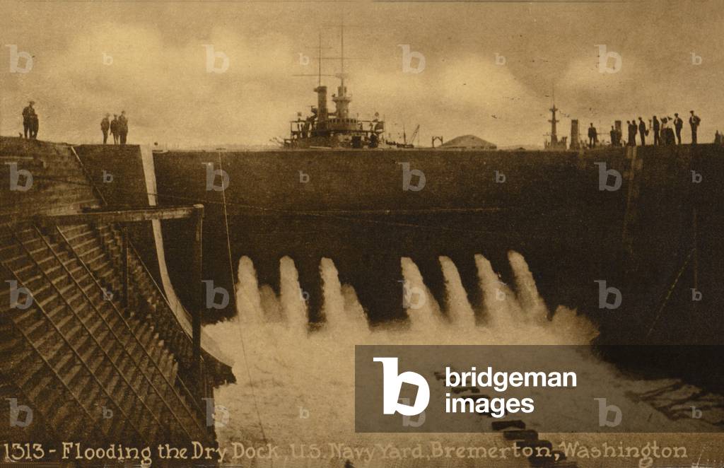 Flooding the dry dock, US Navy Yard, Bremerton; Washington, USA (b/w photo)